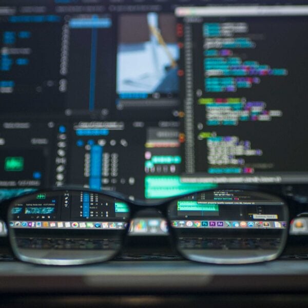 A pair of glasses sitting on top of a computer screen, representing website design.