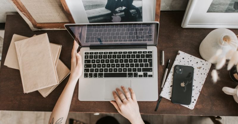 Keywords: woman, laptop, wooden desk