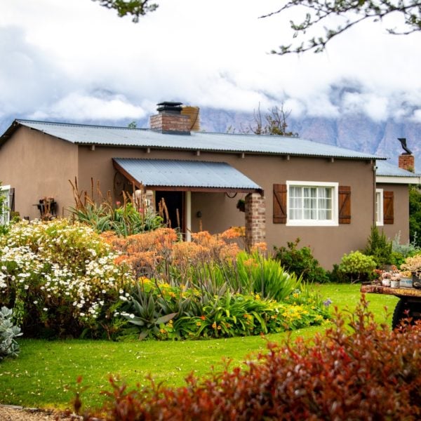 The landscapers transformed the brown house.