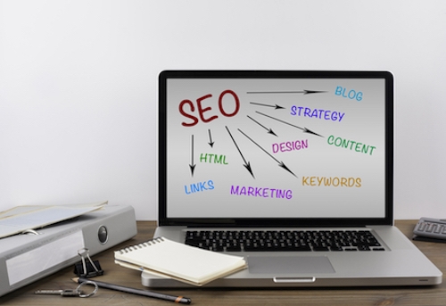 A laptop featuring the keyword "seo" for beginners in Digital Marketing.